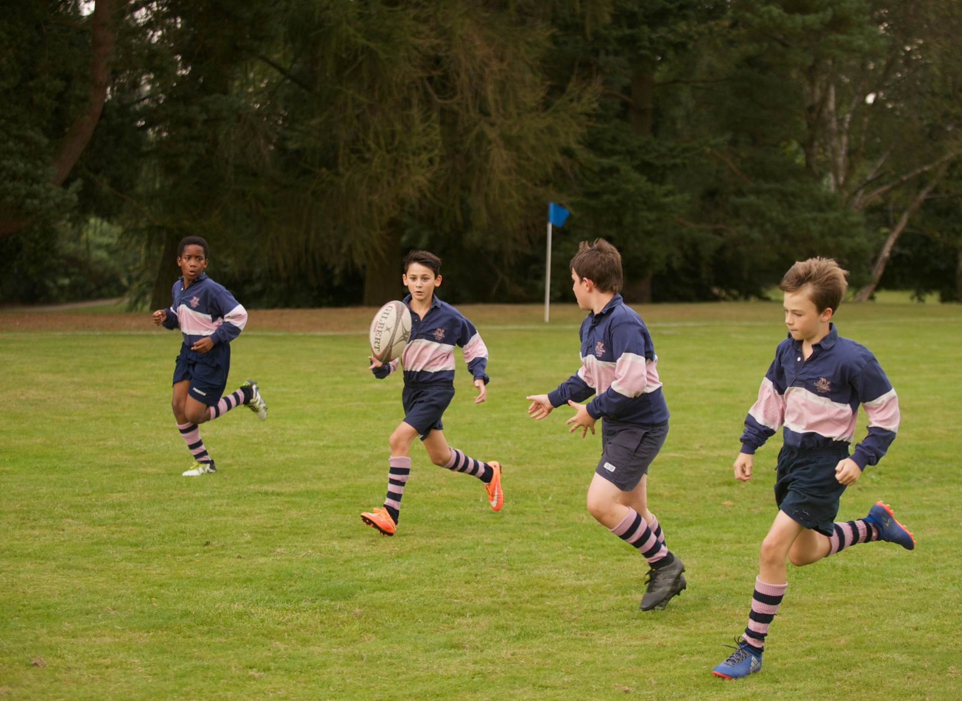 4 students playing rugby