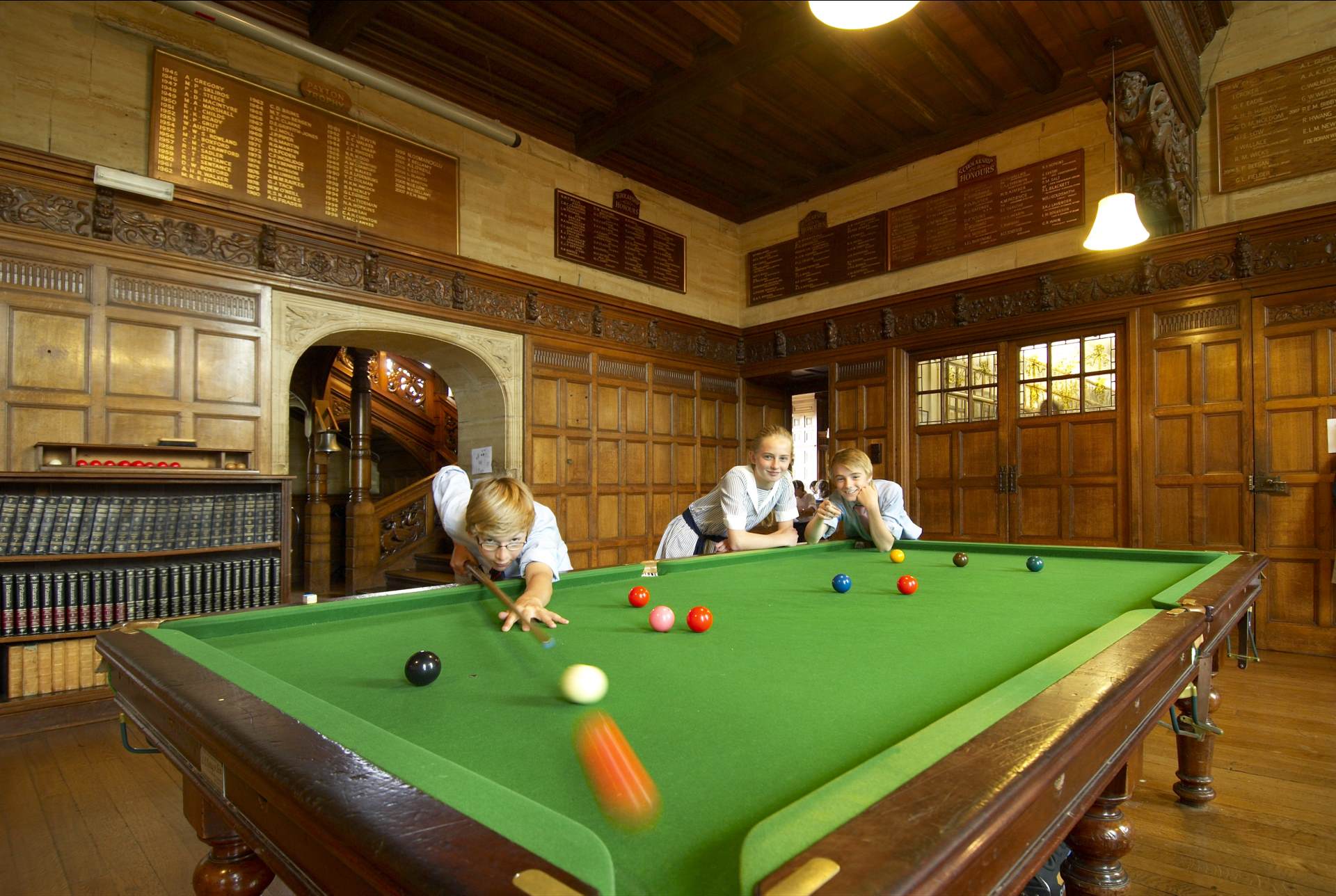 student playing snooker