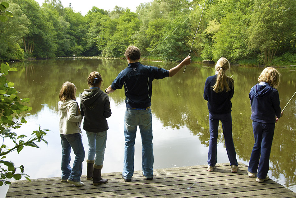 Teacher with 4 students at fishing lake